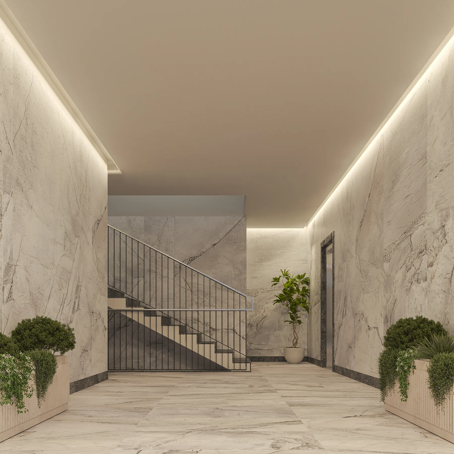 L’androne di un edificio, con pareti in pietra chiara e piante