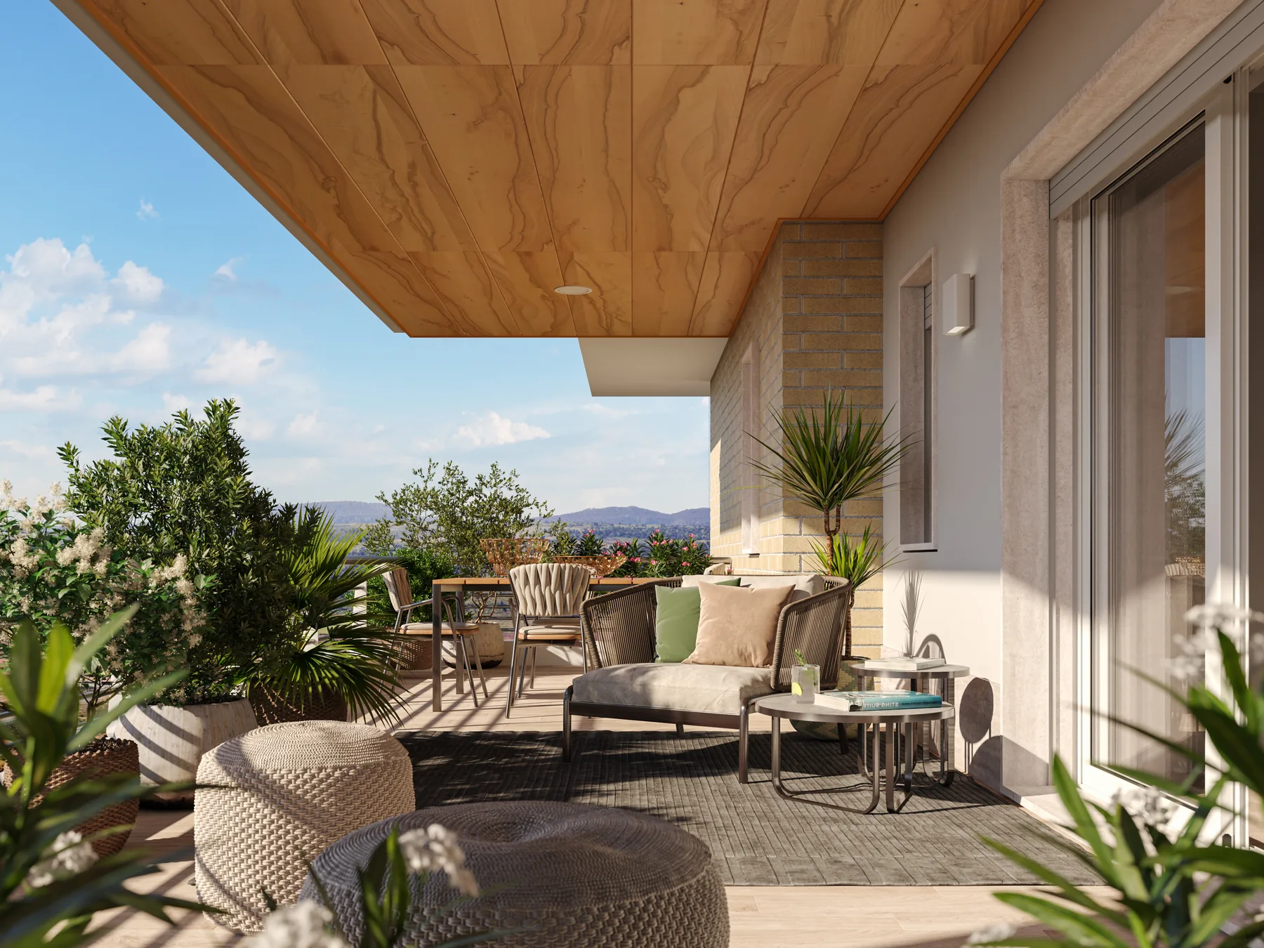 Terrazza arredata con divanetti e piante, sotto un soffitto in legno