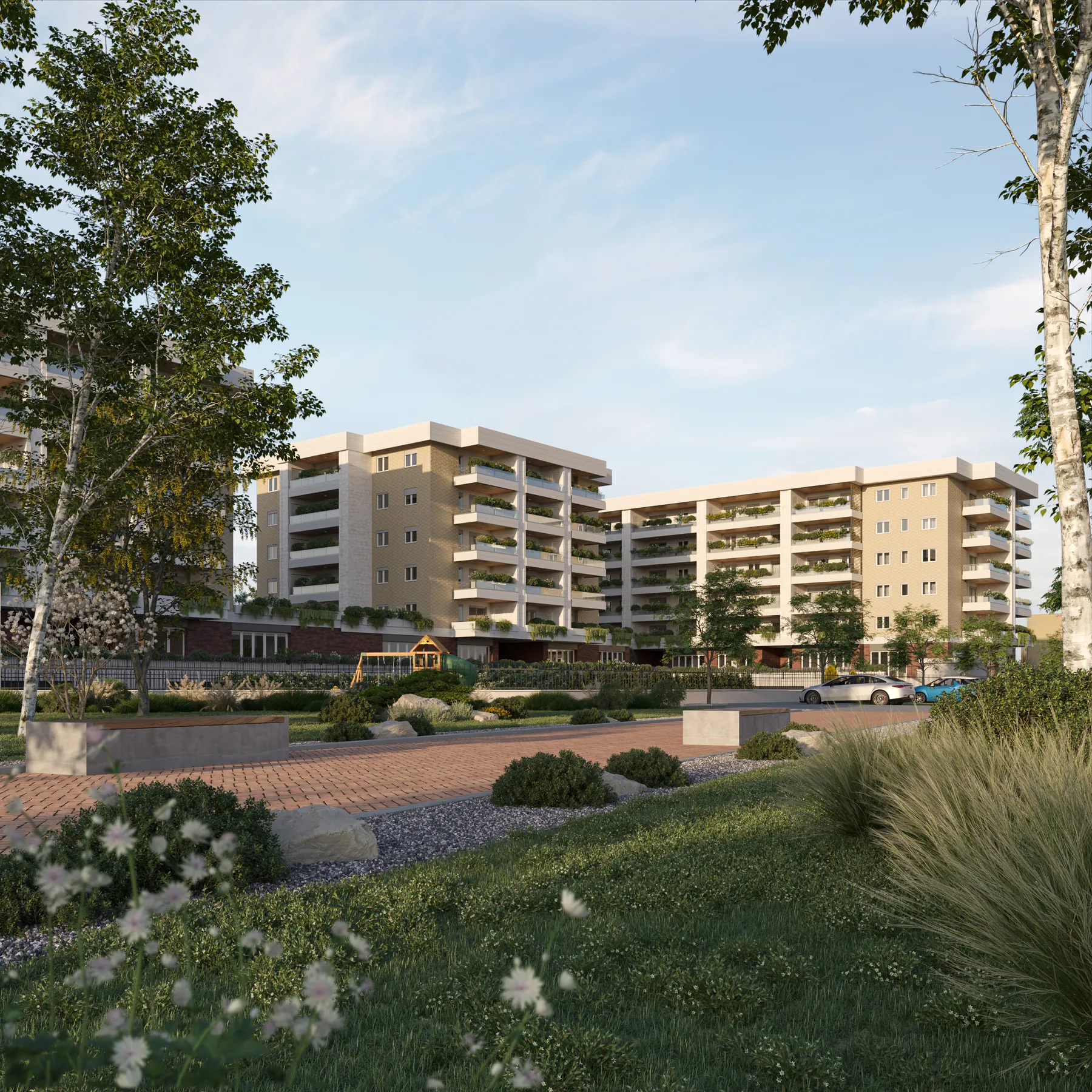 Gli edifici di Urban District visti dal parco, con prati e alberi in primo piano