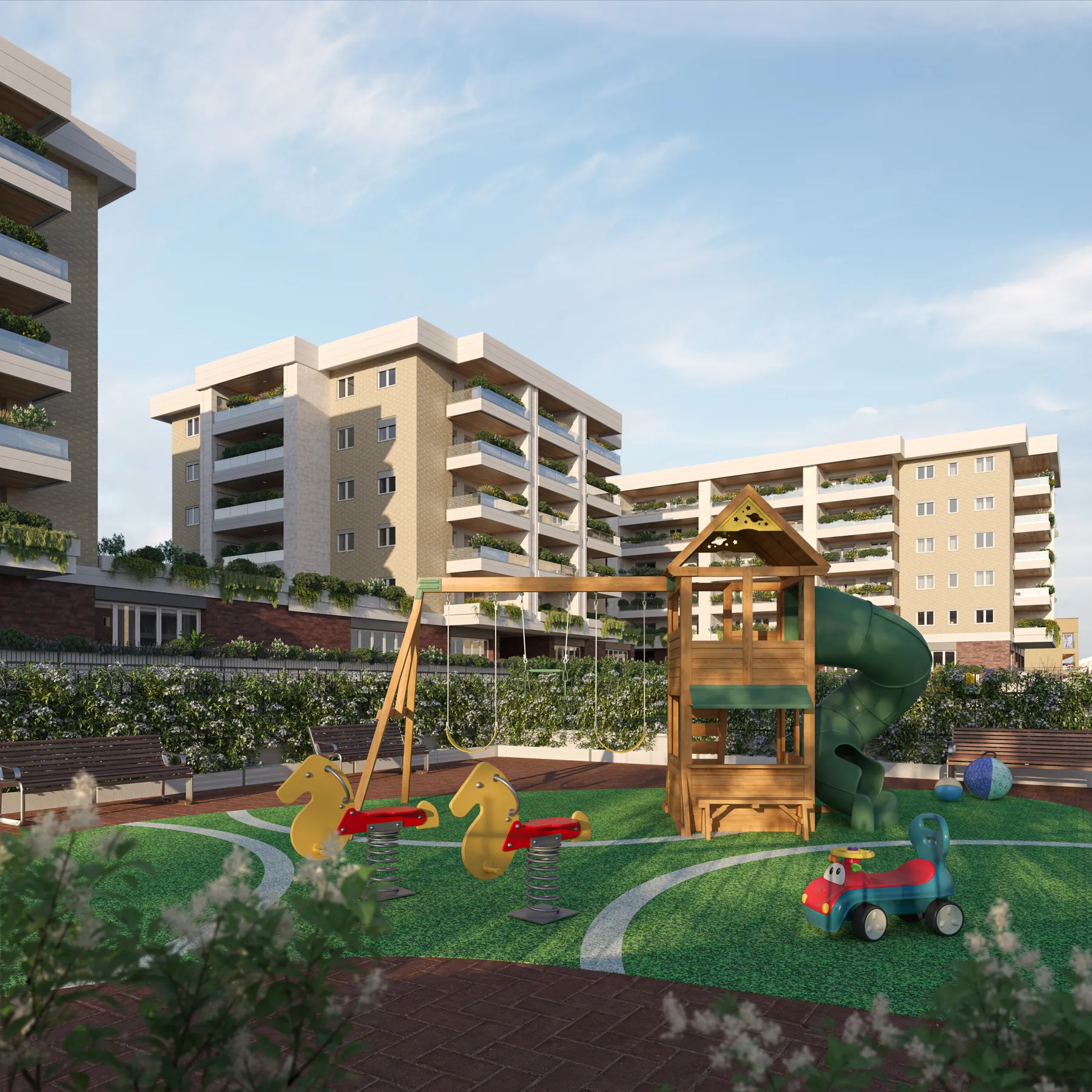 Area giochi nel parco di Città Verde, con gli edifici sullo sfondo